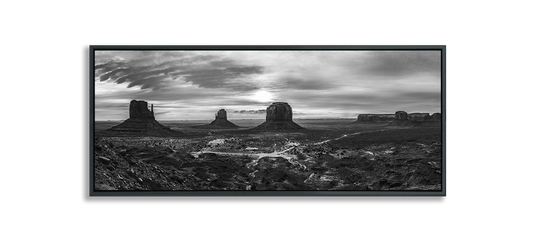 Monument Valley panoramic black and white fine art photograph desert expanse with three classic buttes and more buttes in distance