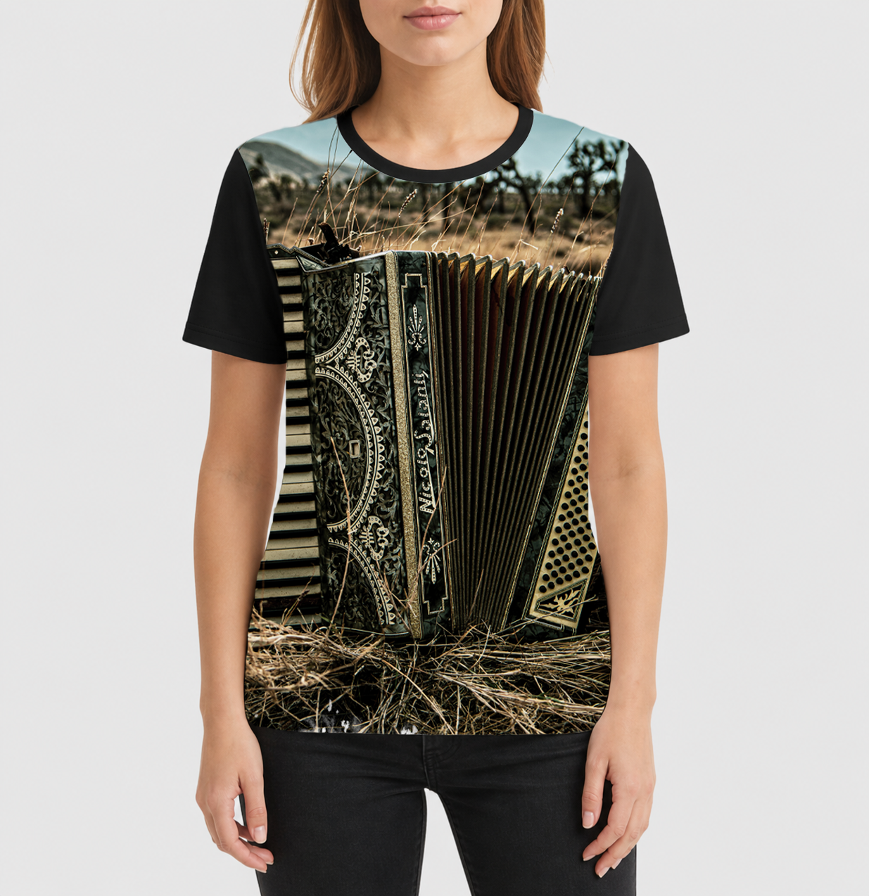 Person wearing a t-shirt with an accordion design on a plain background