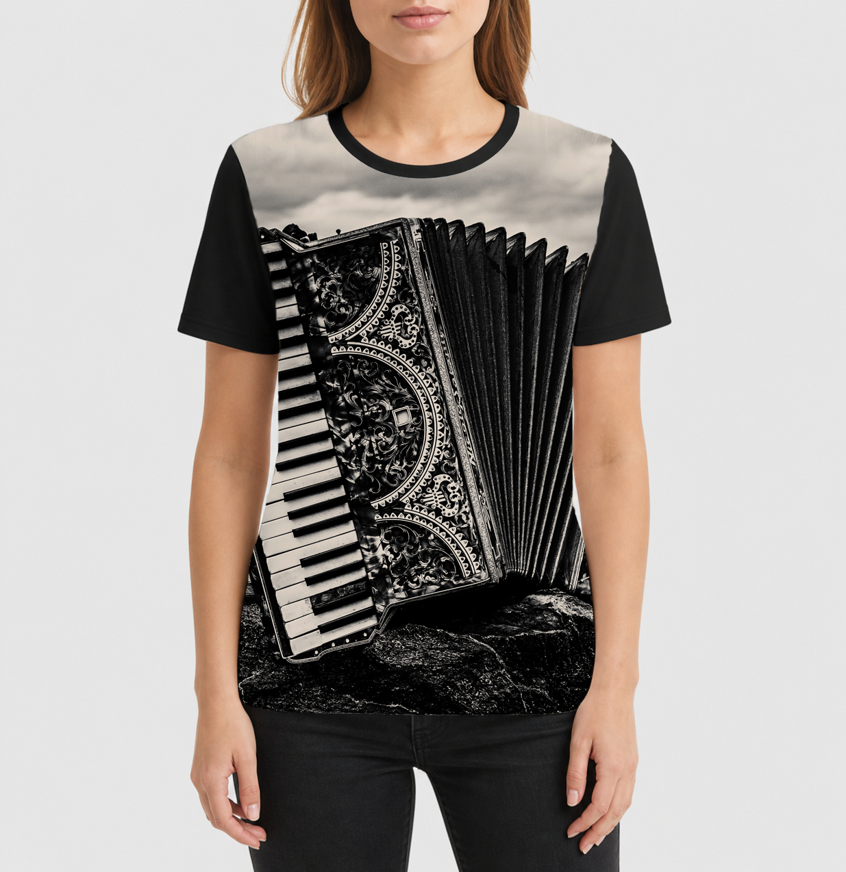 Person wearing a t-shirt with an accordion design on a plain background