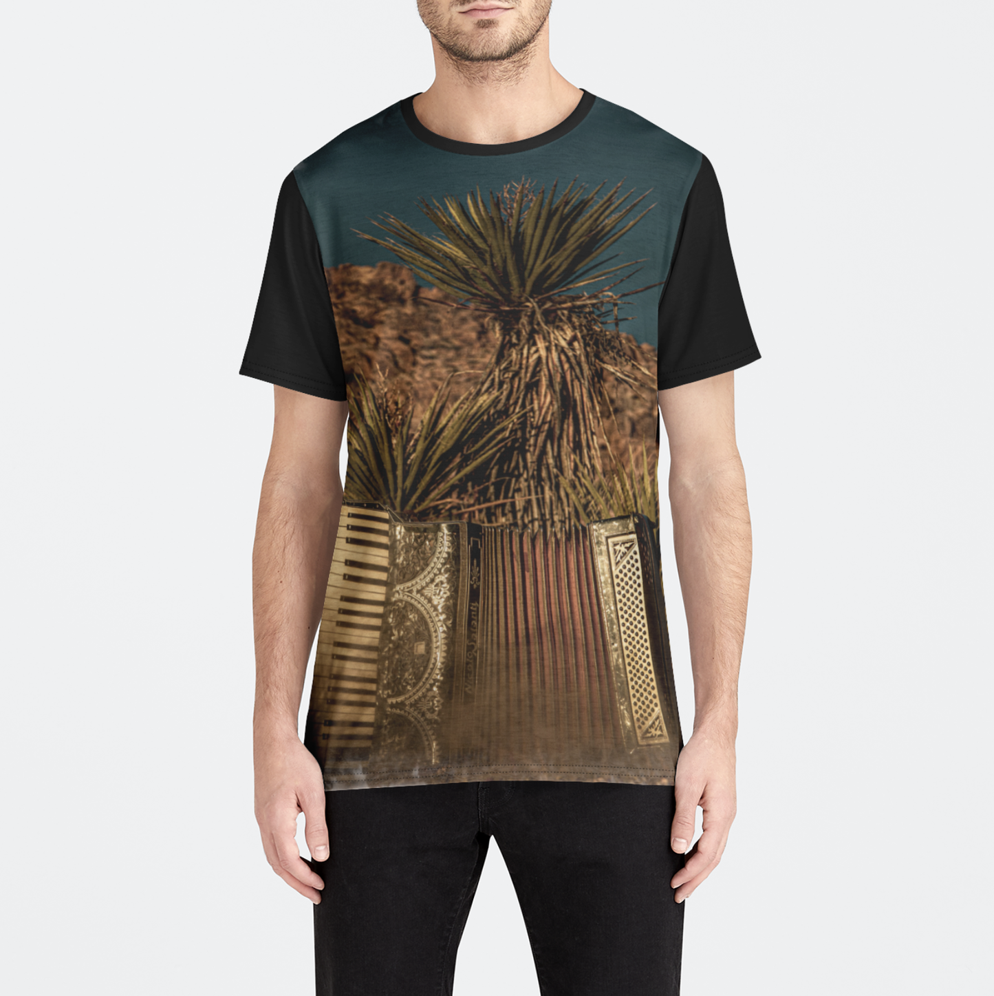 T-shirt with a desert landscape design worn by a person on a white background