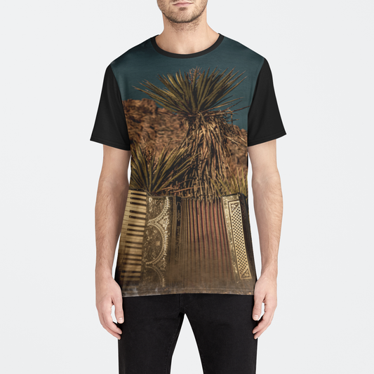 T-shirt with a desert landscape design worn by a person on a white background