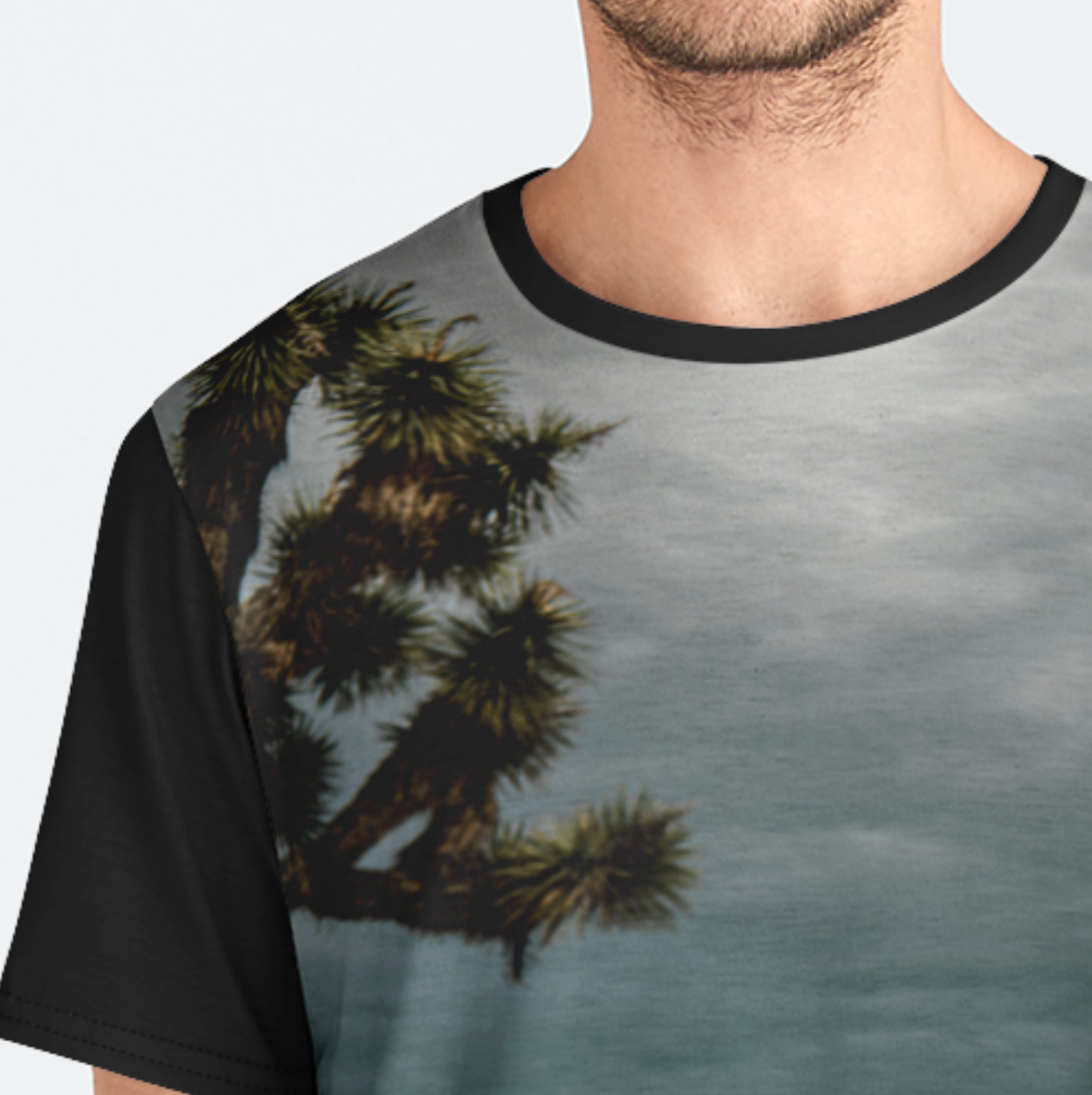 T-shirt with a nature-themed design featuring trees and a sky.