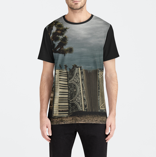 Person wearing a t-shirt with a unique design on a plain background
