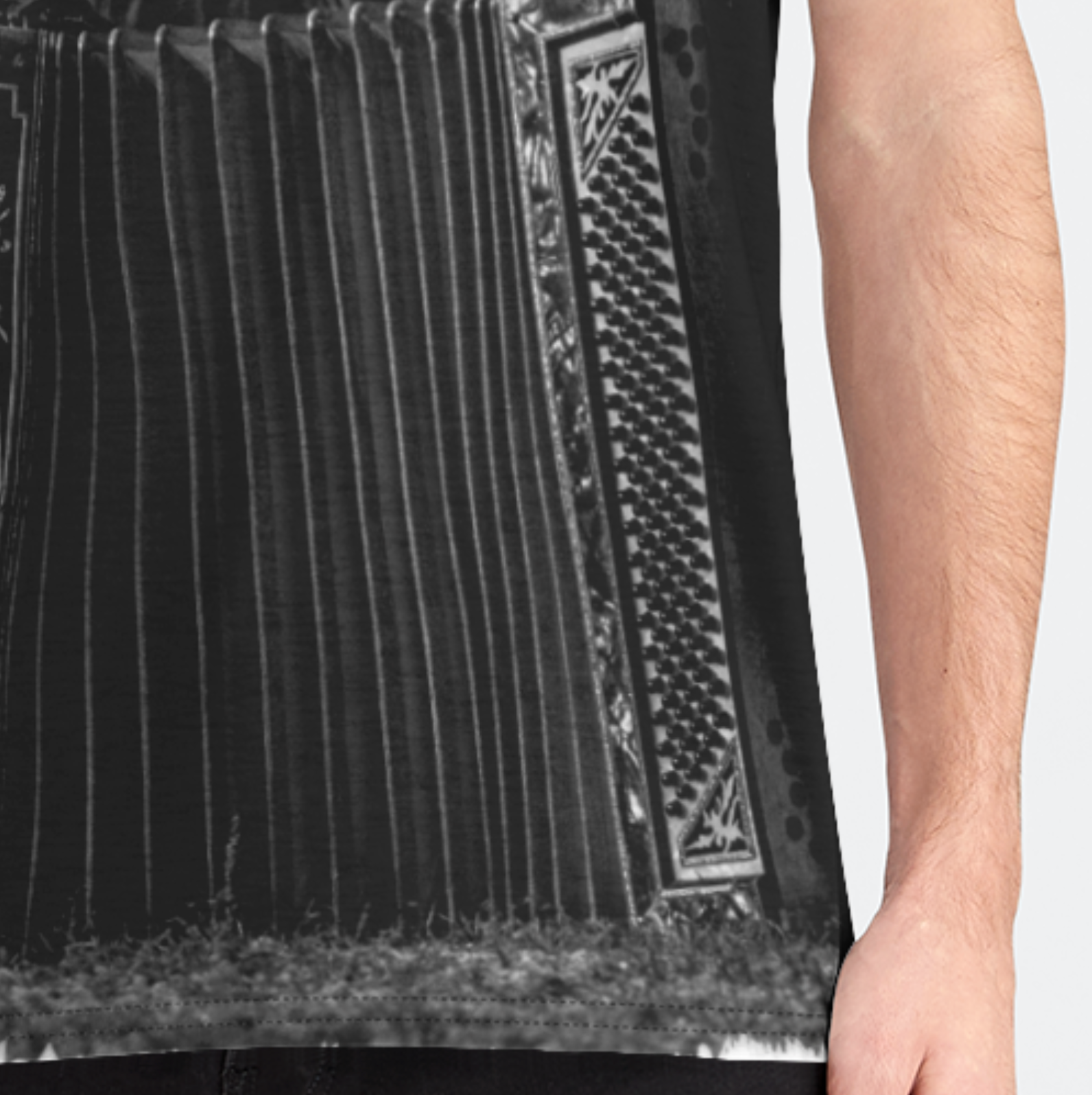 Black apron with geometric pattern worn by a person on a white background