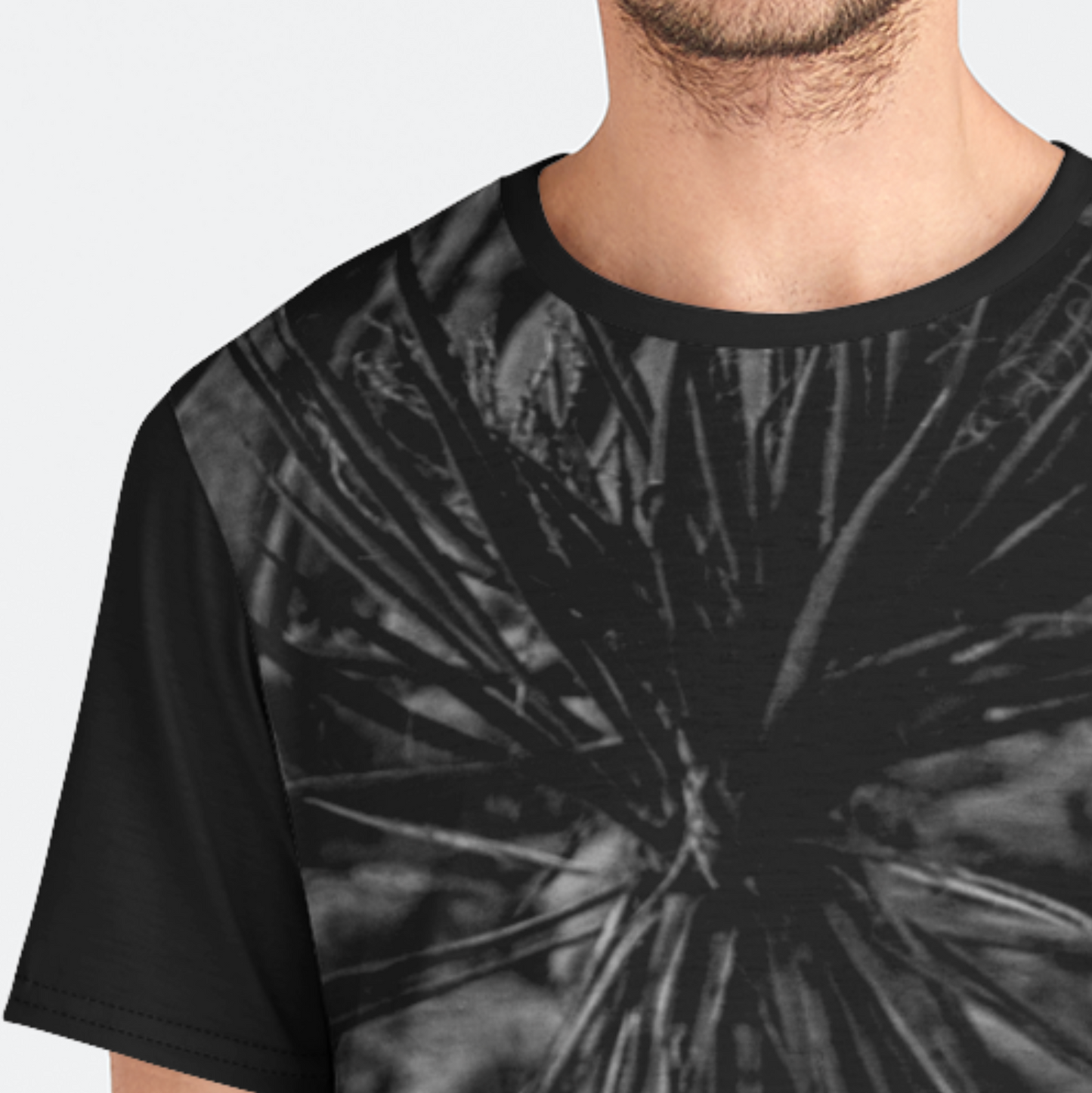Black tie-dye t-shirt worn by a person on a white background