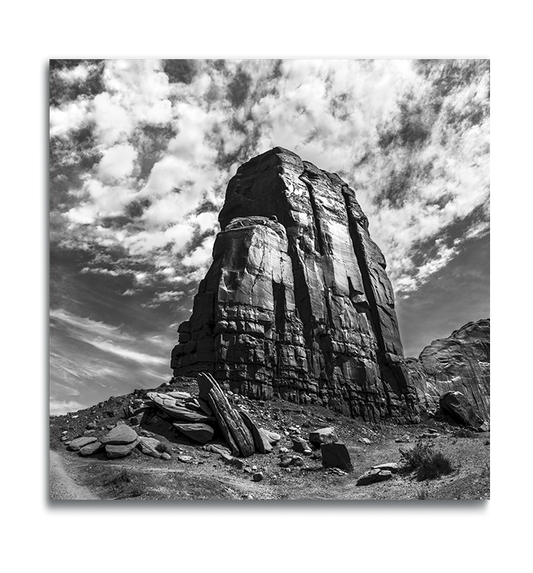 Monument Valley Square Metal Print black and white desert butte against dramatic cloudy sky