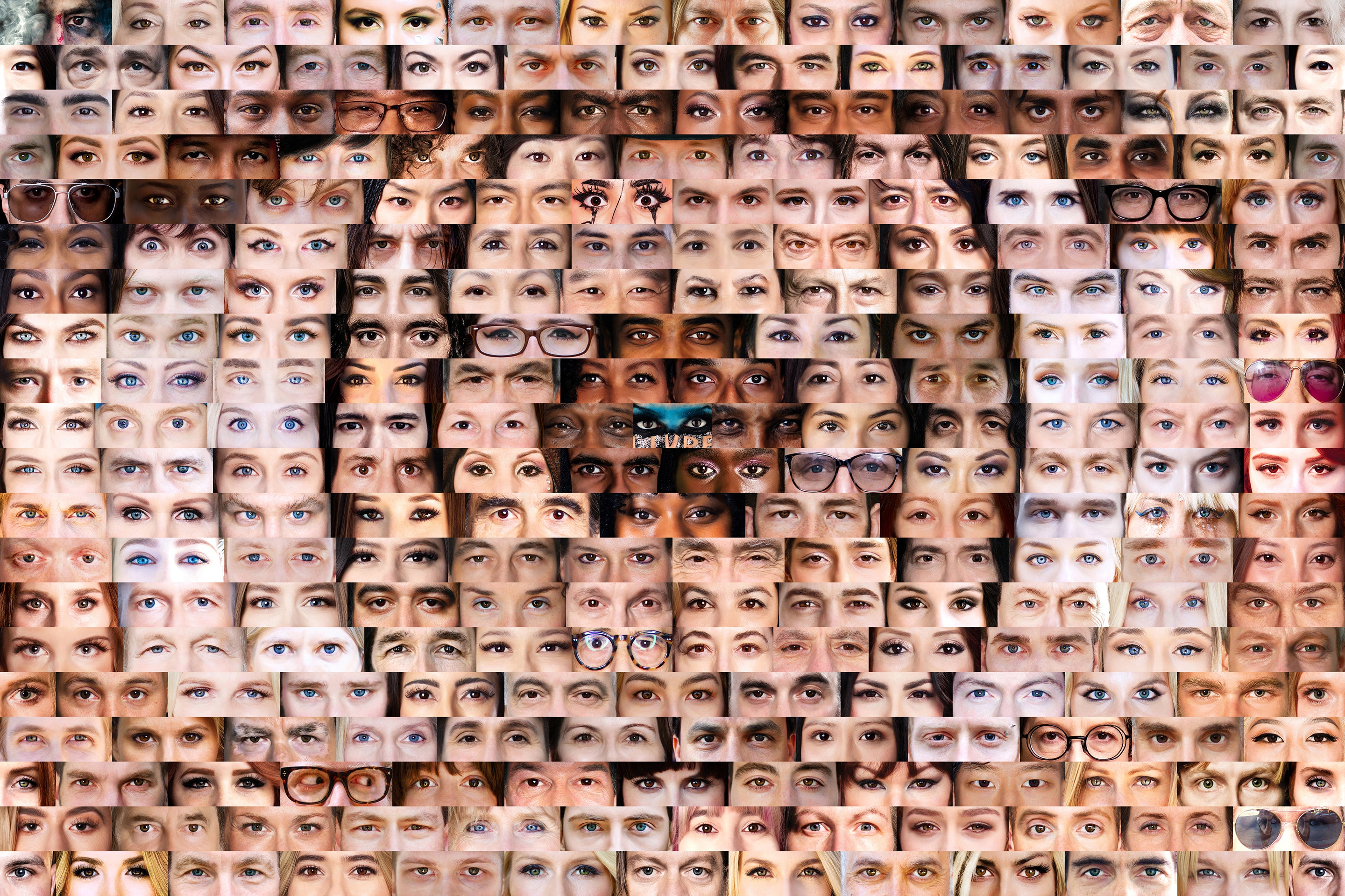 Pattern of various human eyes arranged in a grid.