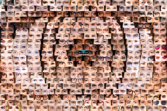 Pattern of various human eyes arranged in a grid.