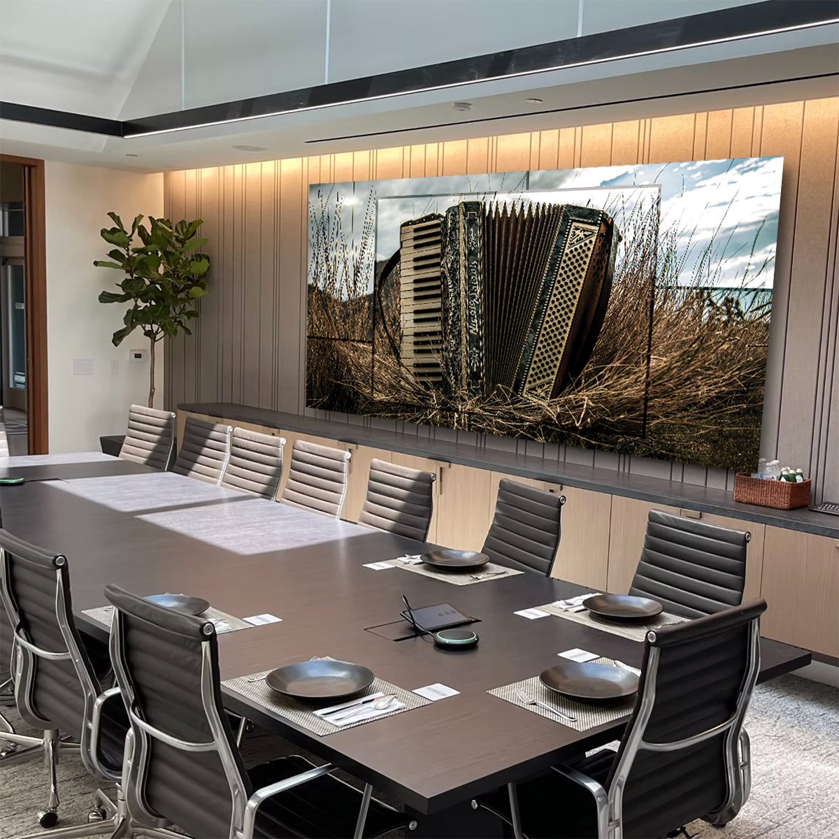 Modern conference room with a large screen displaying an architectural image.