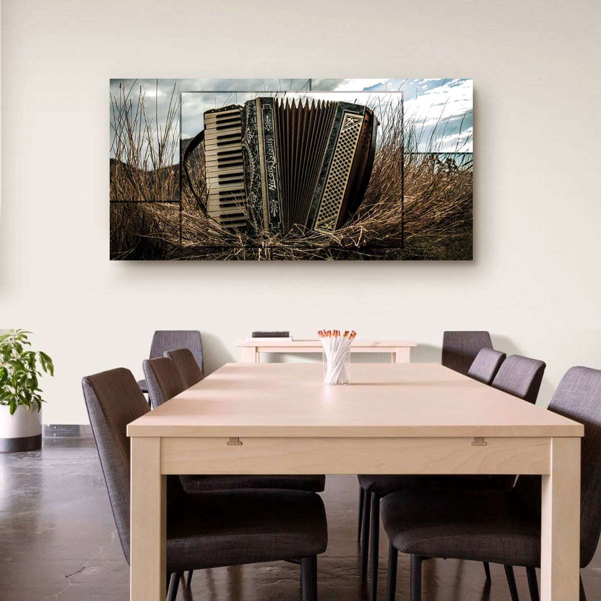 Dining room with a large wall art piece of an accordion.