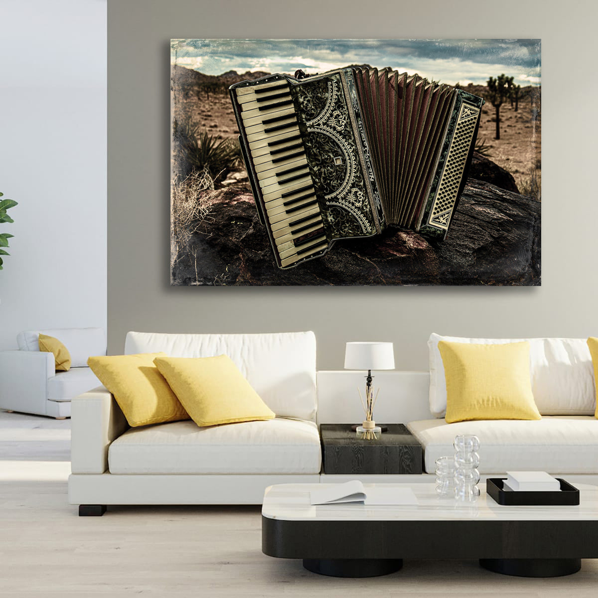 Living room with a white sofa, yellow pillows, and a large painting of an accordion on the wall.