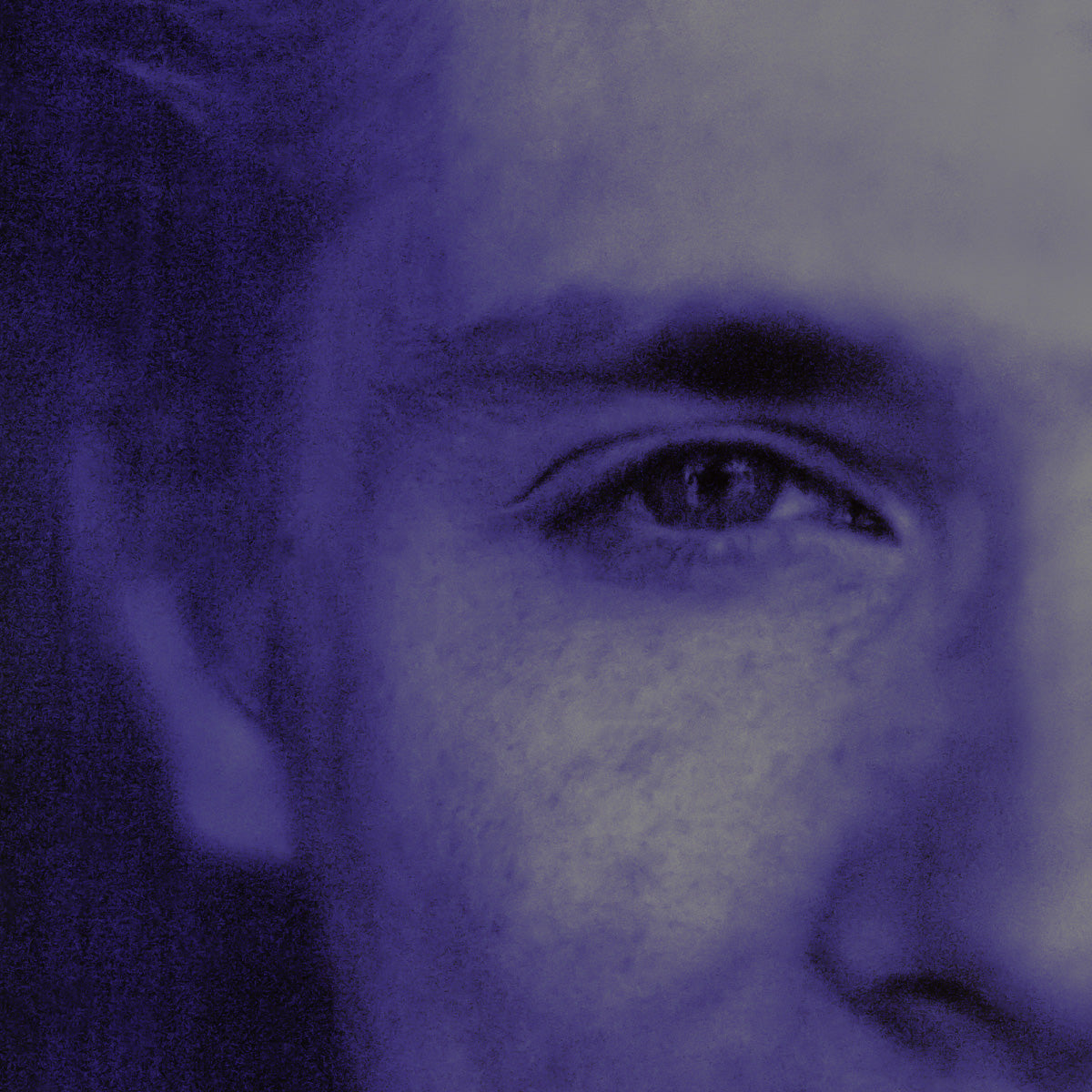 Close-up of a person's eye with a purple filter