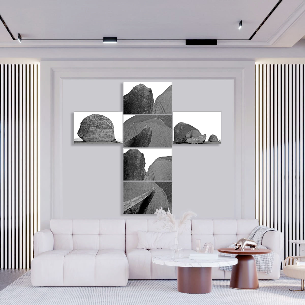 Modern living room with a white sofa, coffee table, and decorative wall art.