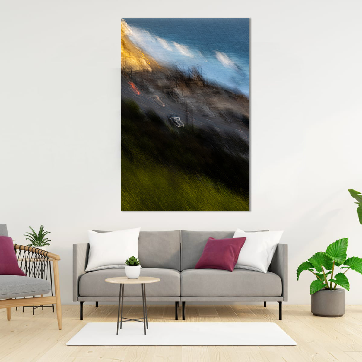 Sofa in a living room with a large abstract painting on the wall.