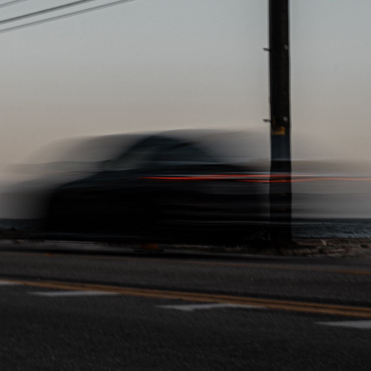 Car driving on a road with a blurred effect