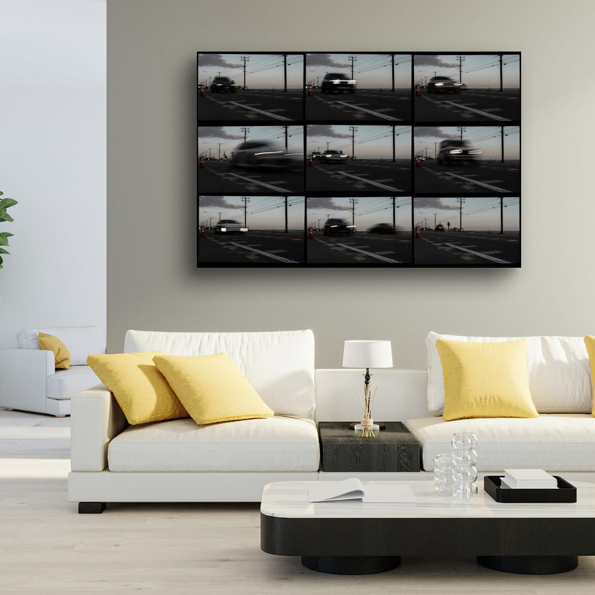 Modern living room with a white sofa, yellow cushions, and a wall-mounted video art piece.