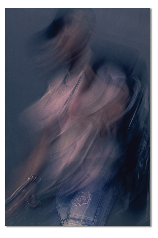 Abstract blurred image of a person with a dark background