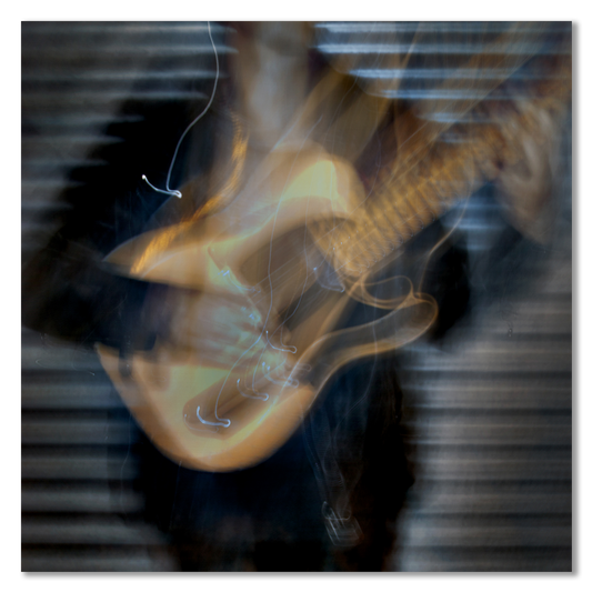 Abstract image of a guitar with blurred motion effect