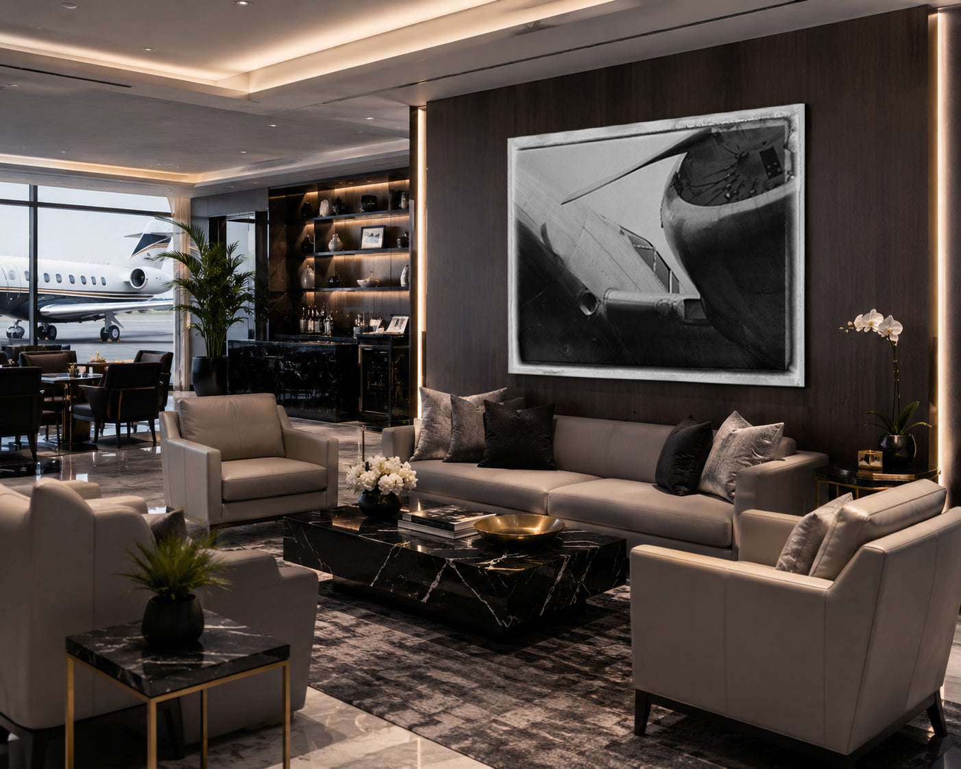 A luxury modern living room featuring a large black and white framed art print of an airplane on a dark wood wall above a beige sofa. The room is styled with contemporary beige armchairs, a black marble coffee table, and a patterned rug, with a window in the background showing a real airport tarmac and a plane.