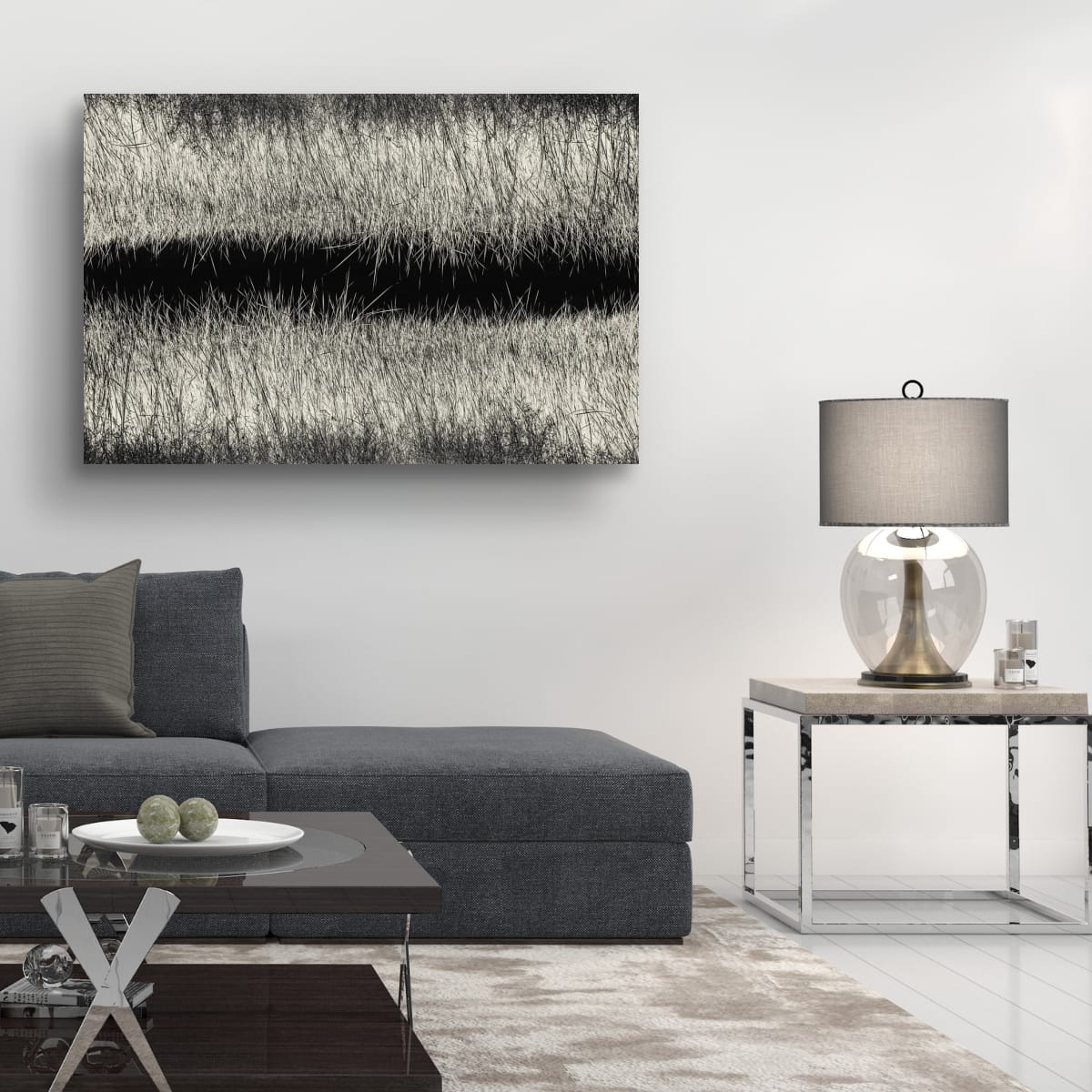 Modern living room with a gray sectional sofa, coffee table, and abstract painting on the wall.