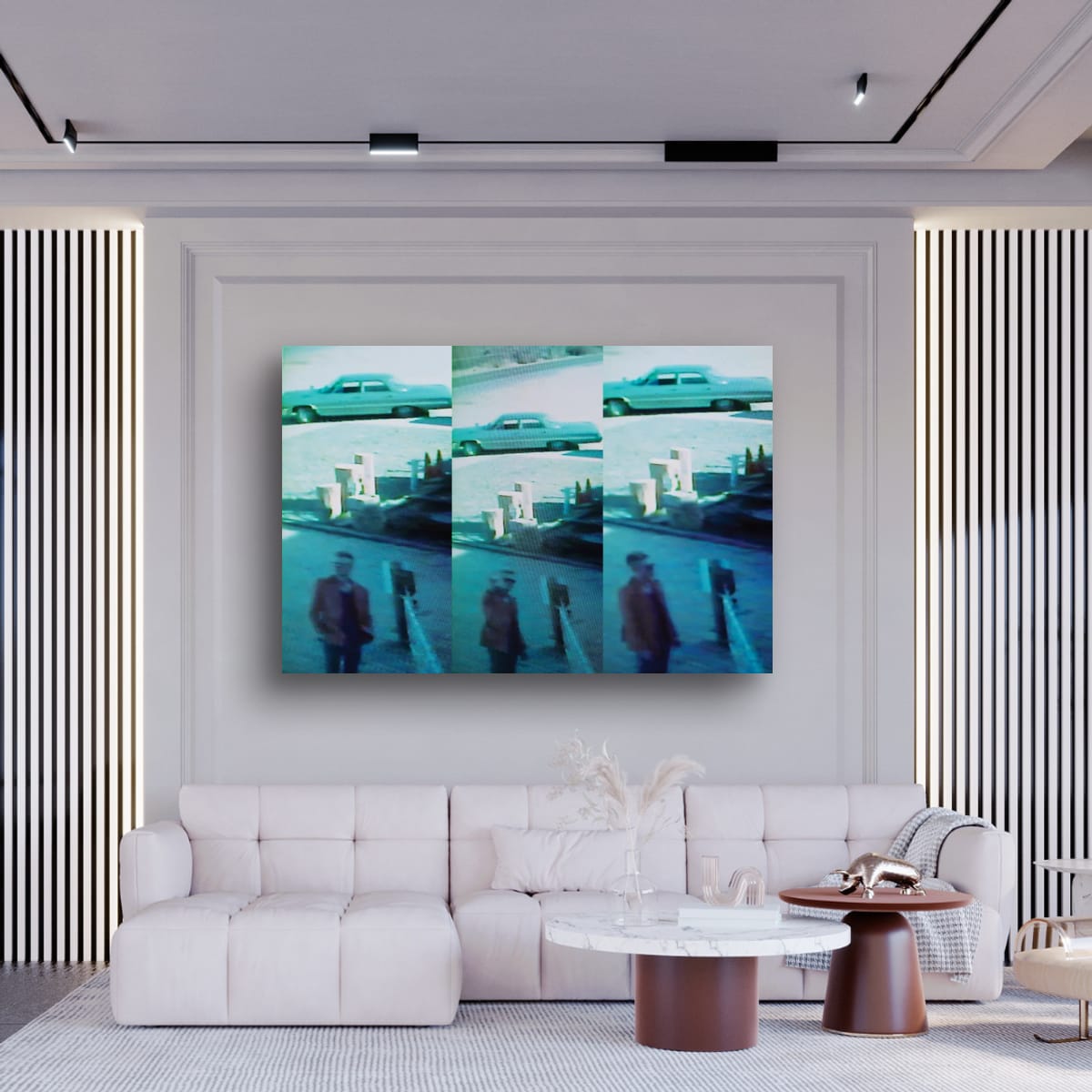 Modern living room with a white sofa, coffee table, and wall art displaying a collage of images.