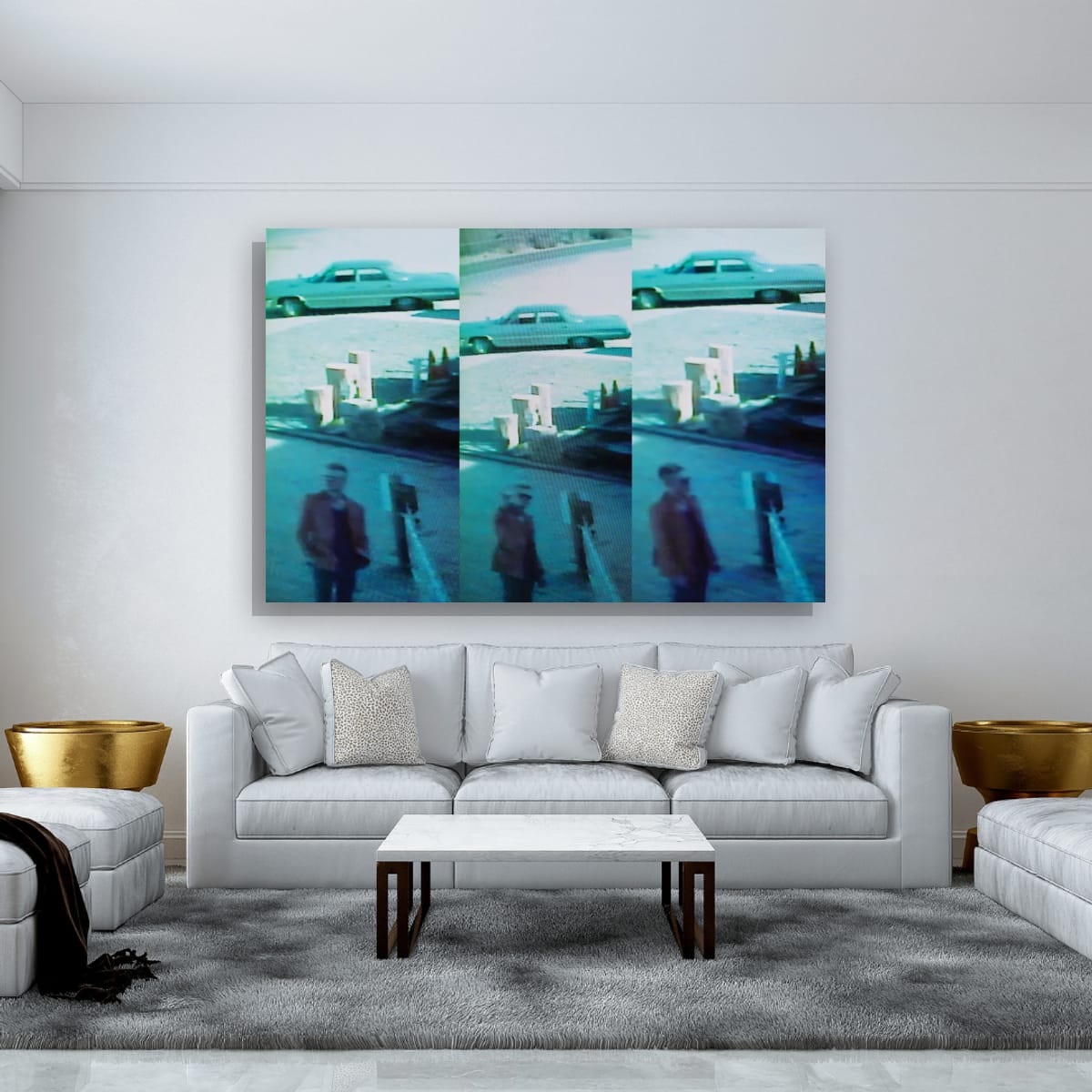 Living room with a white sofa, coffee table, and wall art of a turquoise car and people.