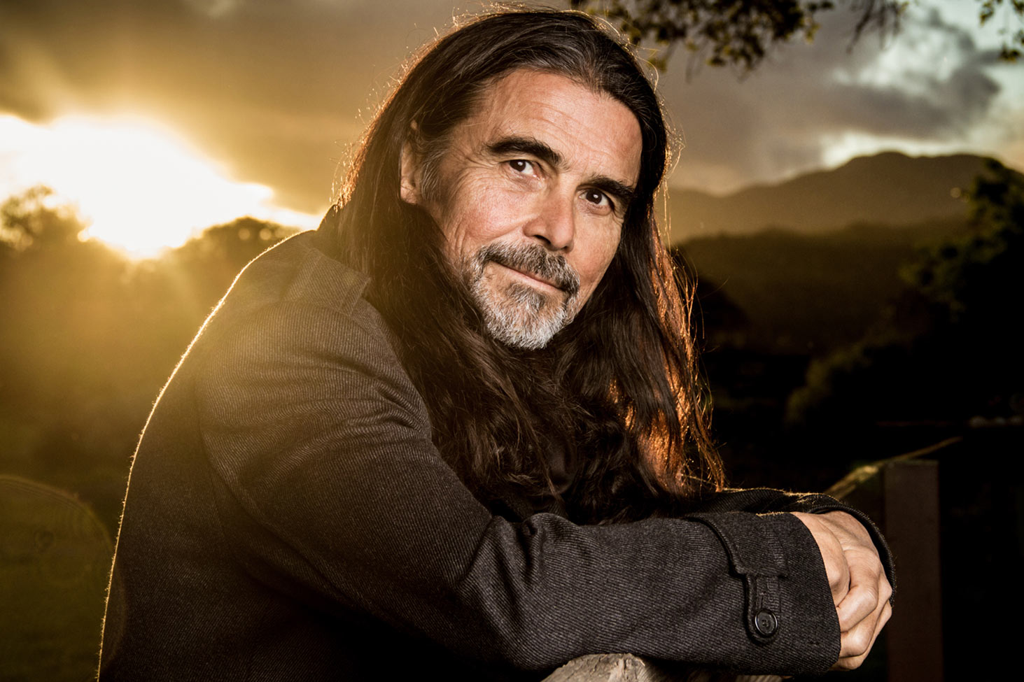 Musician Portrait Jess Wayne leaning on fence at sunset Ojai California