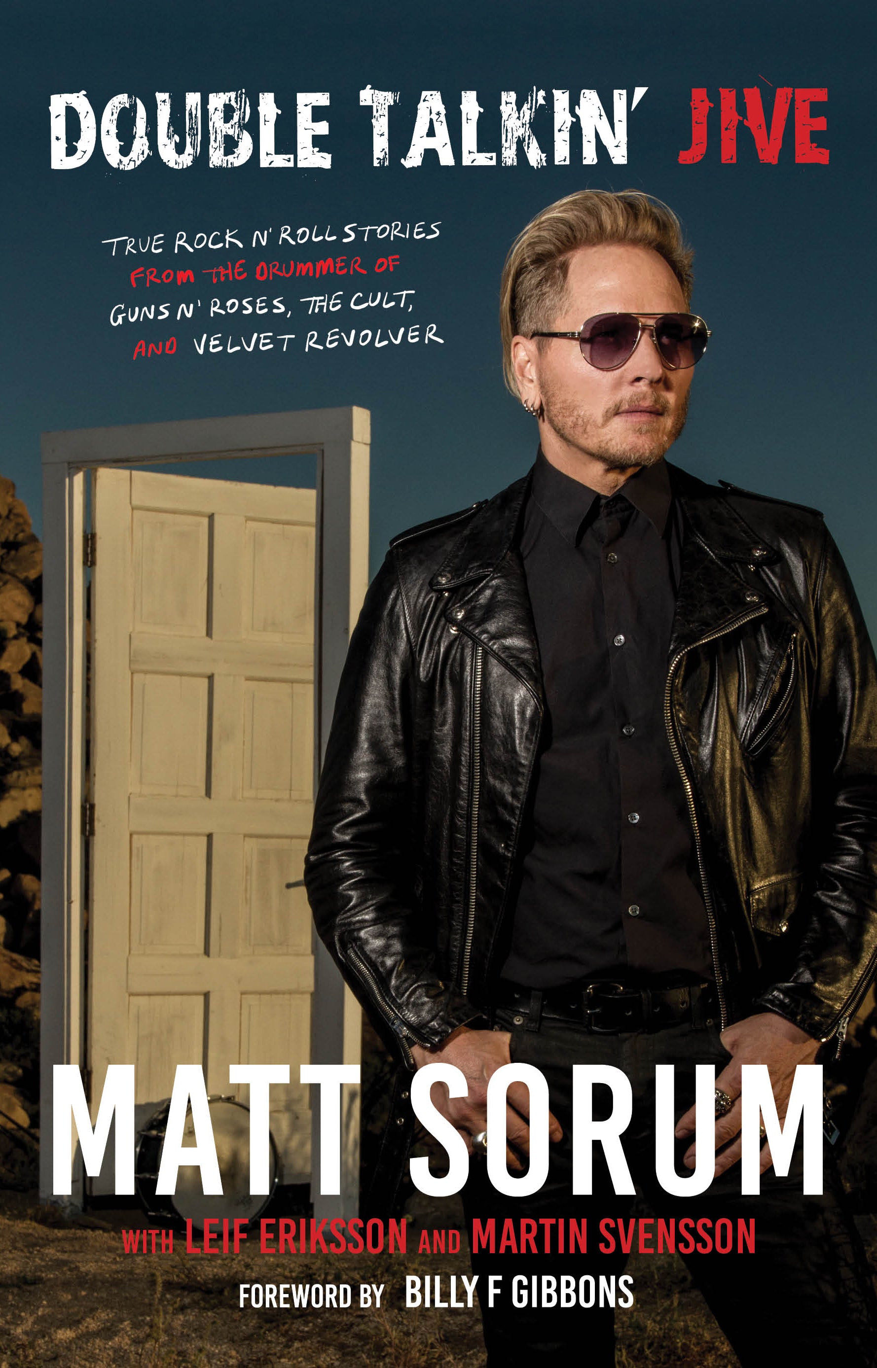 Matt Sorum Double Talkin Jive Autobiography Cover Portrait standing in front of free standing door in desert