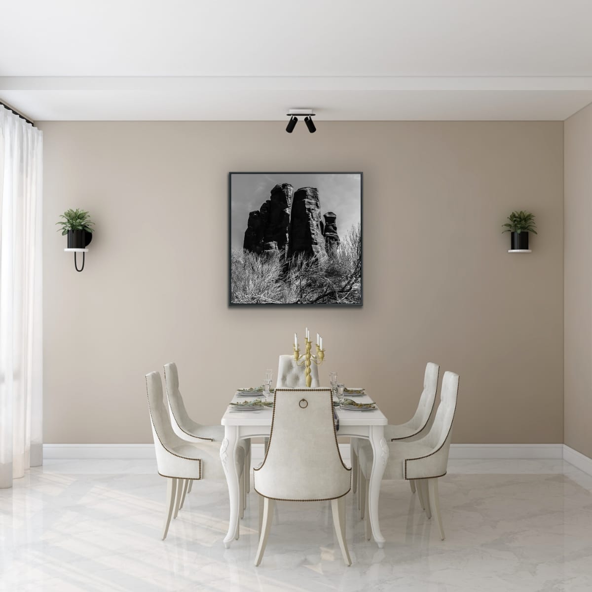 Dining room with a table set for six, chairs, and a framed picture of a black and white 48x48 photograph of rock formations with desert vegetation on the wall.