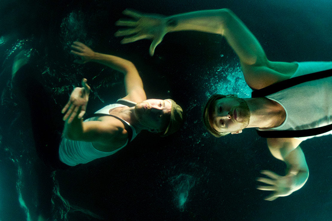 Musician portrait underwater Kyprios swimming with bubbles floating from his mouth