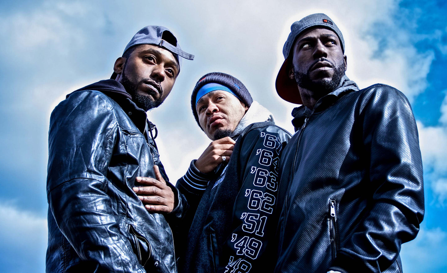 Trio Musician Portrait Black Lion Empire low angle perspective members standing against clouds in sky