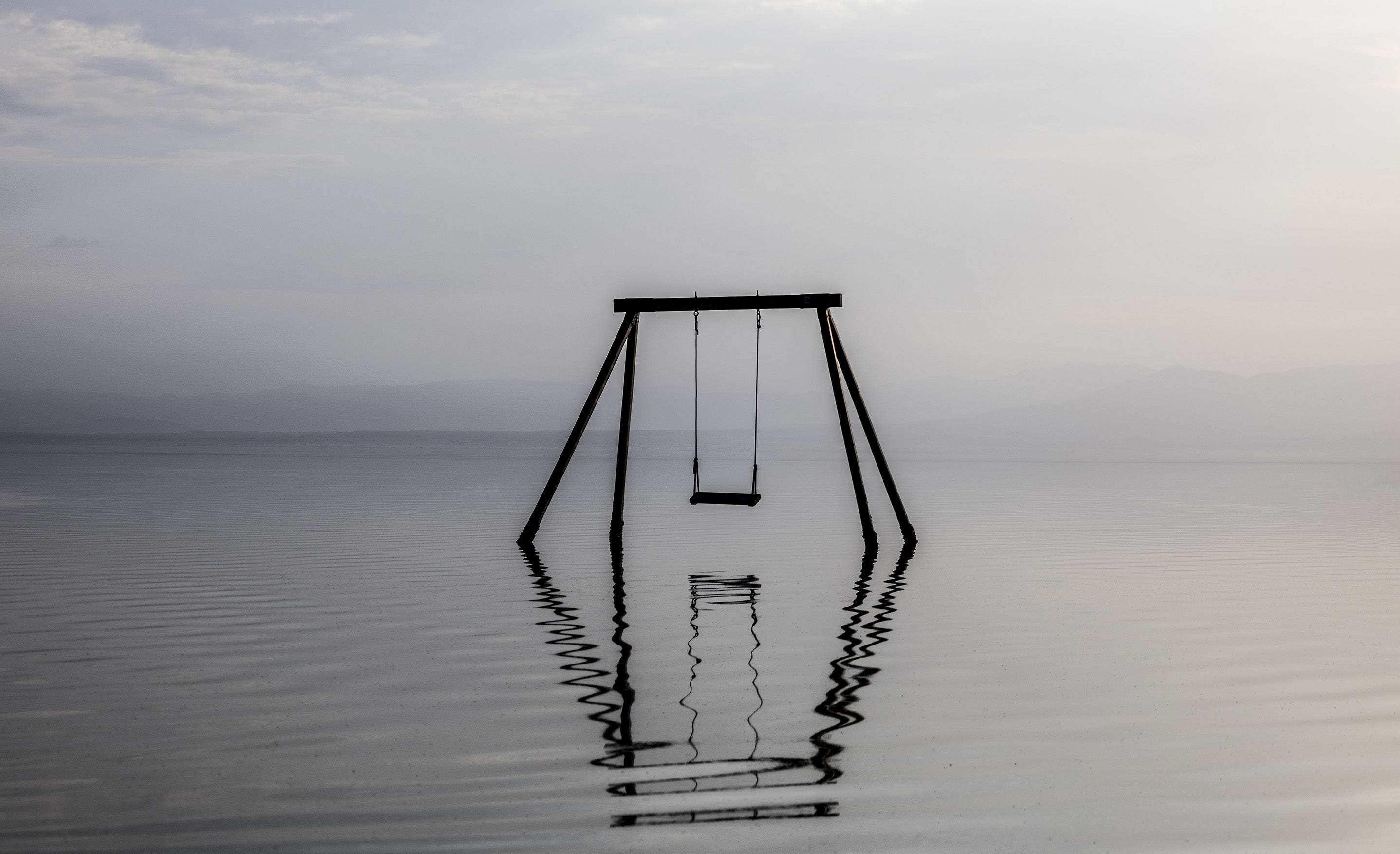 Fine art photographic print swing set submerged in water Salton Sea