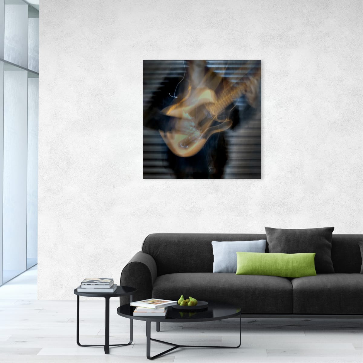 Modern living room with a dark gray sofa, coffee table, and abstract painting on the wall.