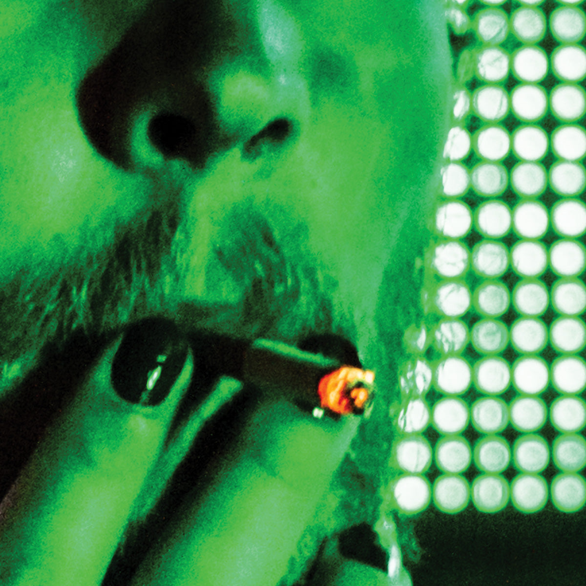 Close-up of a person smoking a cigarette with a green filter effect.