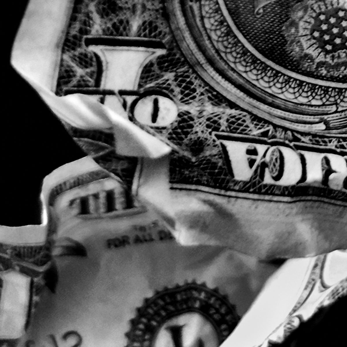 Close-up of a dollar bill with a blurred background
