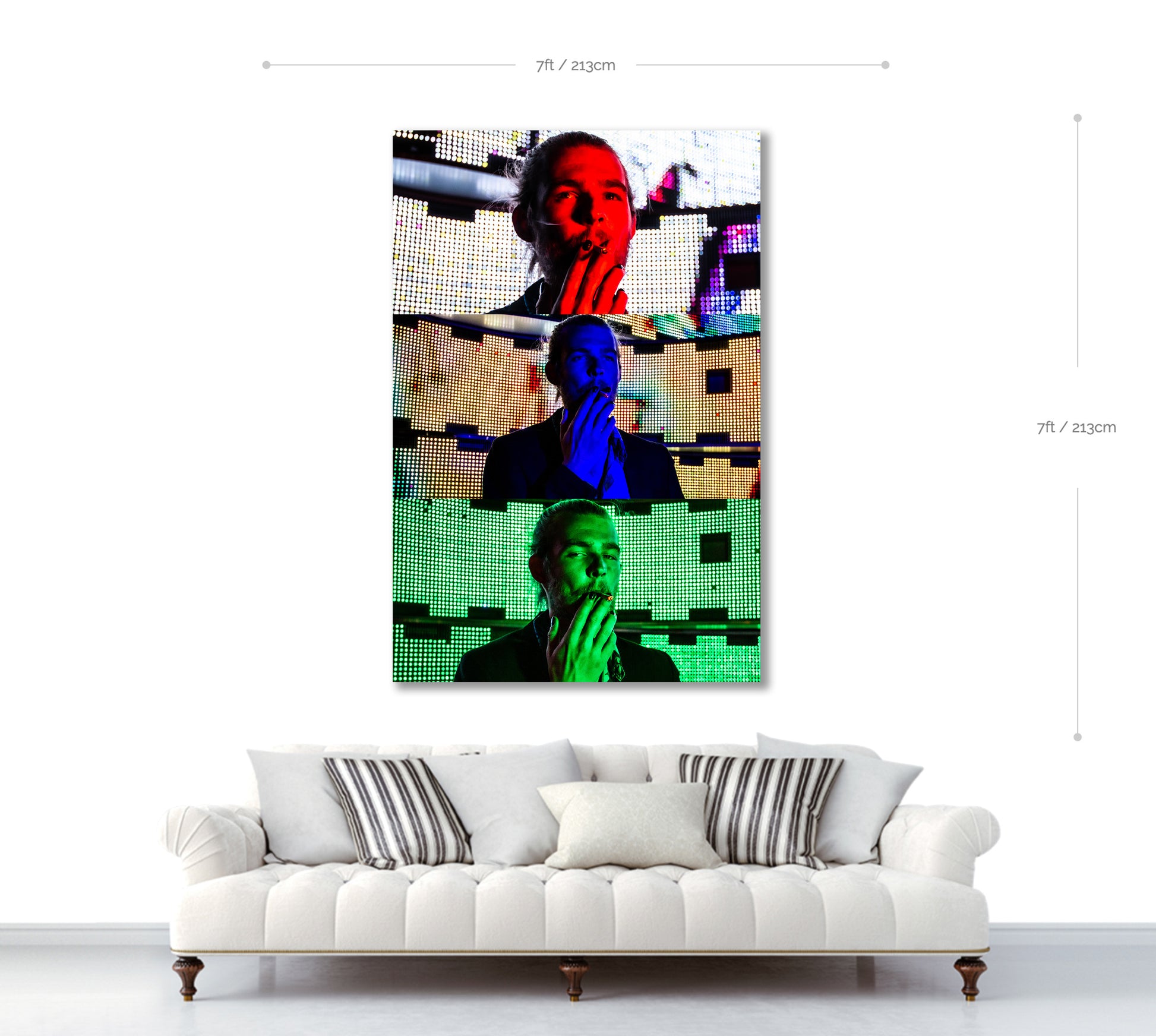 Modern abstract artwork on a wall above a white sofa with decorative pillows.