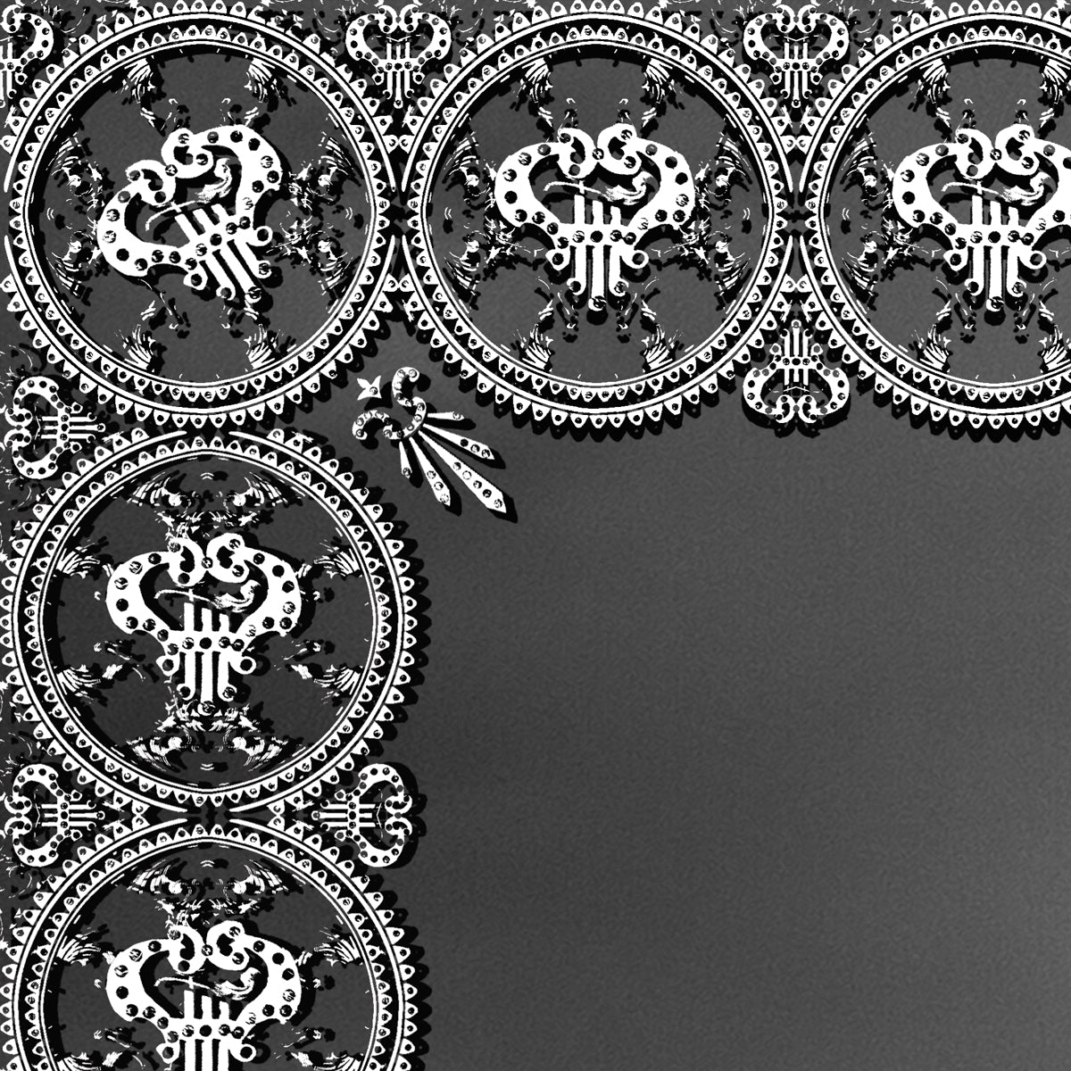 Decorative black and white pattern on a dark background